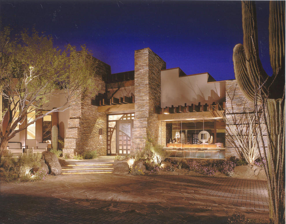 Photo of a large one-storey beige house exterior in Phoenix with concrete fiberboard siding.
