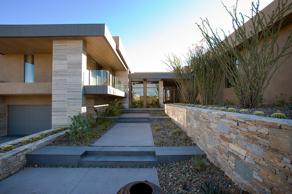 Design ideas for an expansive modern front yard xeriscape in Phoenix with a garden path.