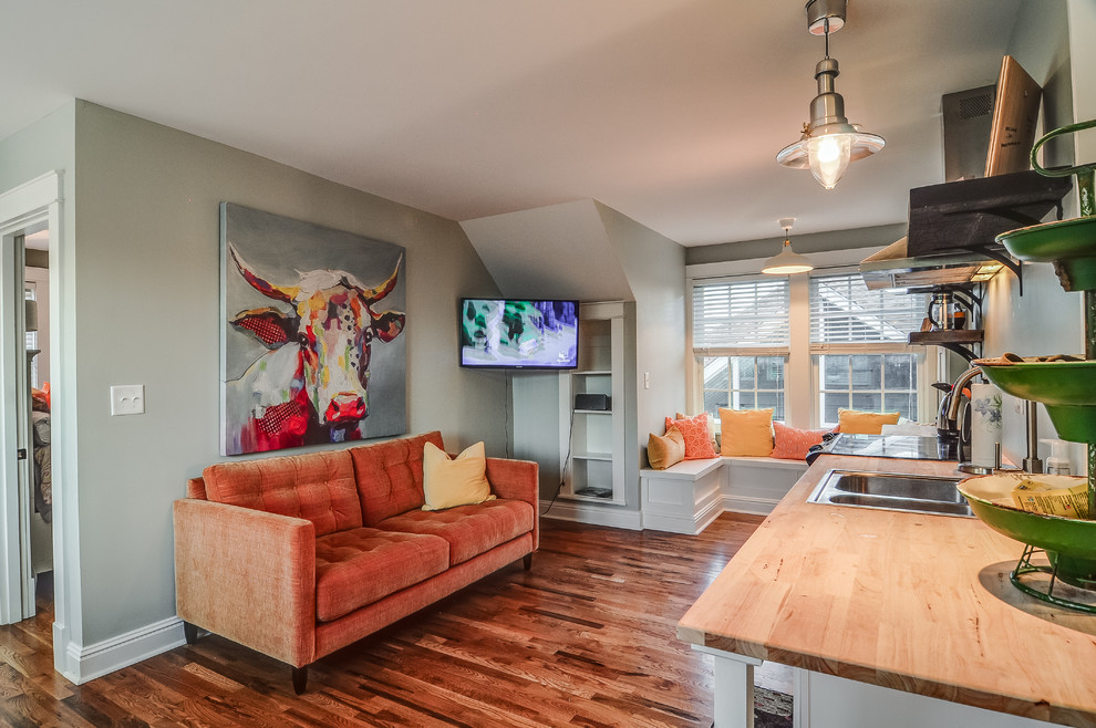 Small arts and crafts open concept living room in Nashville with grey walls and medium hardwood floors.