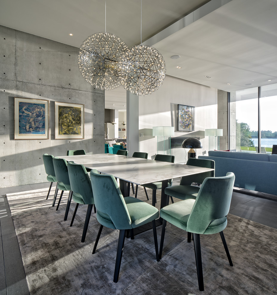 This is an example of a contemporary open plan dining in Tampa with grey walls and dark hardwood floors.