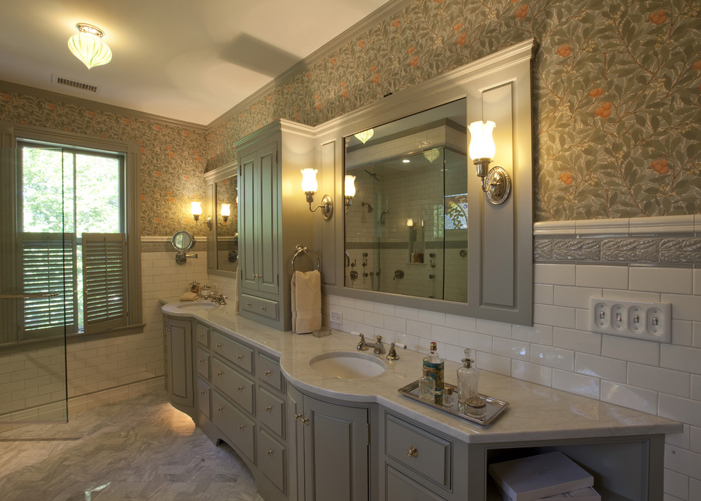 Traditional bathroom in Boston with marble benchtops.