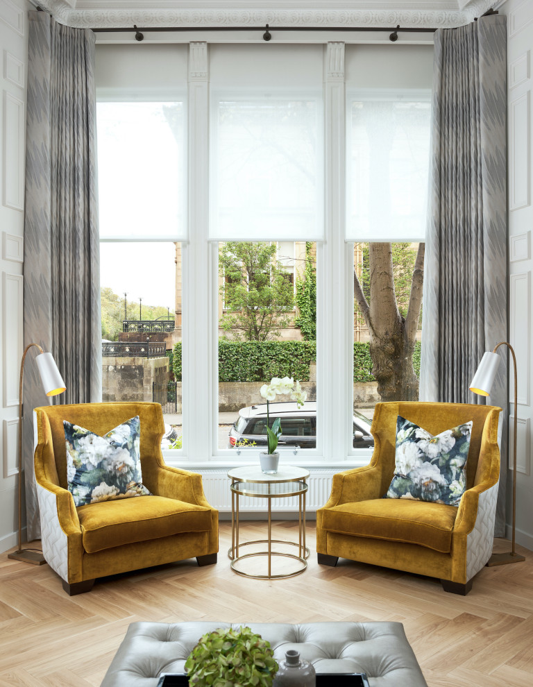 Design ideas for a contemporary grey and yellow living room in Glasgow with brown floors and feature lighting.