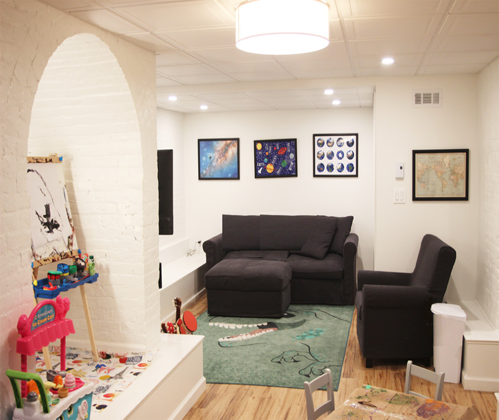 Photo of a mid-sized fully buried basement in New York with white walls, vinyl floors and brown floor.