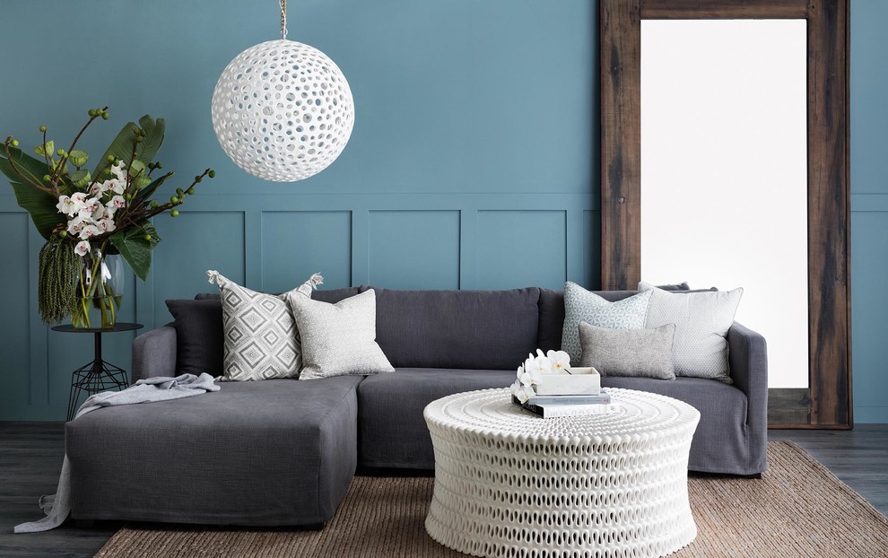 Inspiration for a beach style living room in Sydney with blue walls and no fireplace.