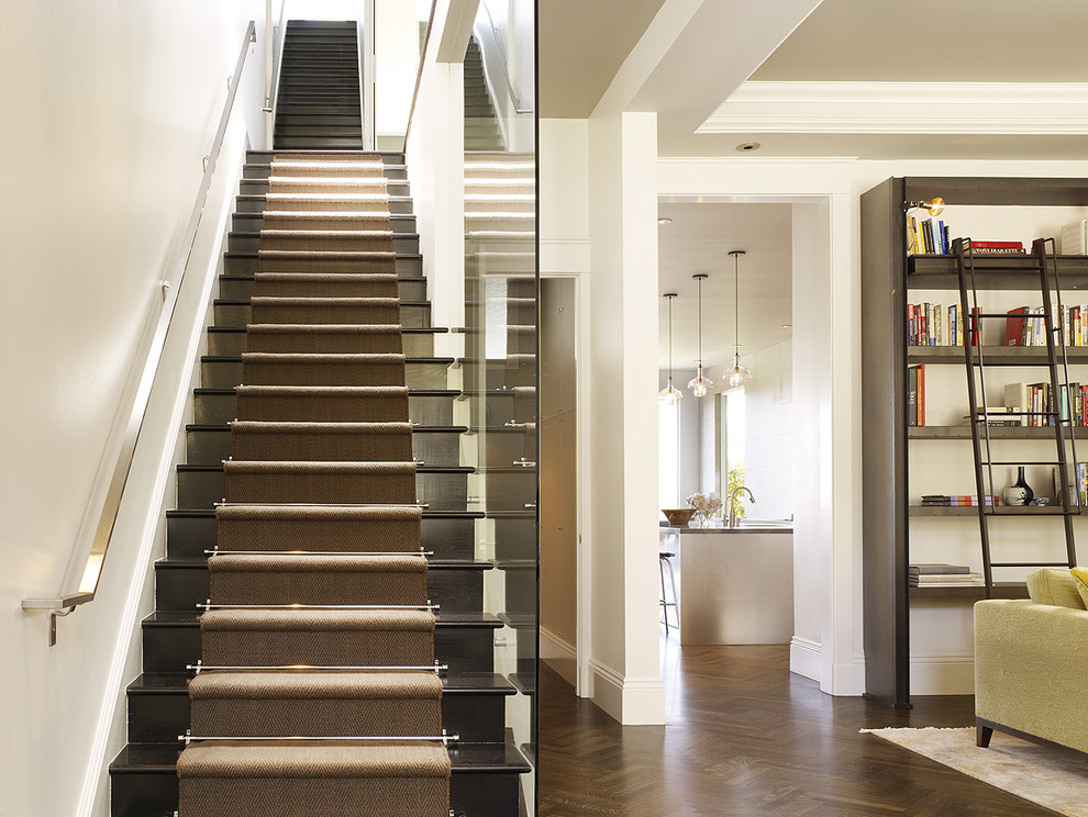 Photo of a transitional wood straight staircase in San Francisco with wood risers.