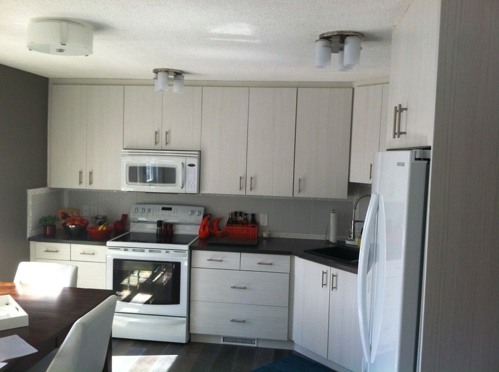 Example of a transitional kitchen design in Calgary