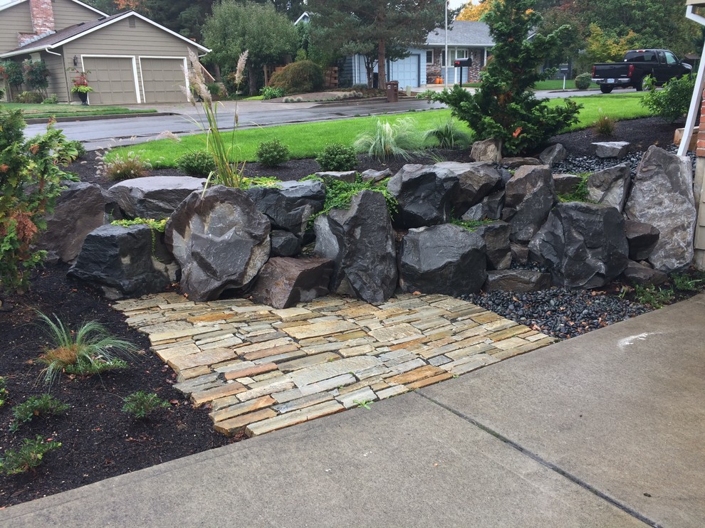 Mid-sized contemporary front yard full sun garden in Portland with natural stone pavers.