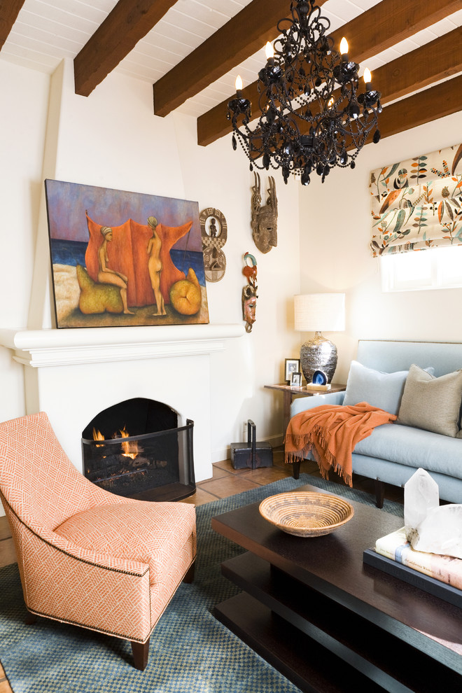 Eclectic living room in Orange County with terra-cotta floors, a standard fireplace and no tv.