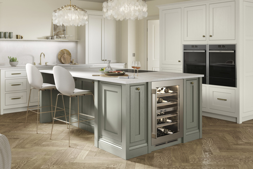Design ideas for a medium sized traditional l-shaped kitchen/diner in Other with a submerged sink, light wood cabinets, quartz worktops, black appliances, light hardwood flooring, an island and white worktops.