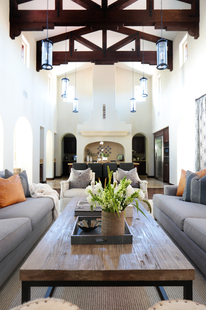 Photo of an expansive mediterranean formal open concept living room in Orange County with white walls and dark hardwood floors.