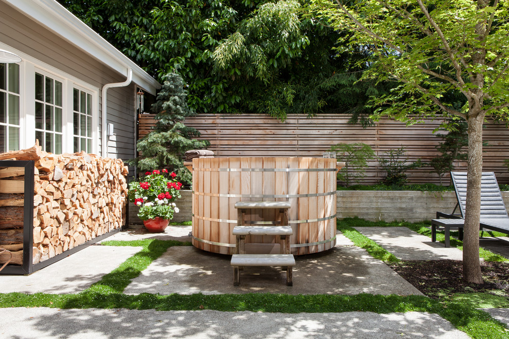 Design ideas for a small transitional backyard patio in Portland with concrete pavers and no cover.