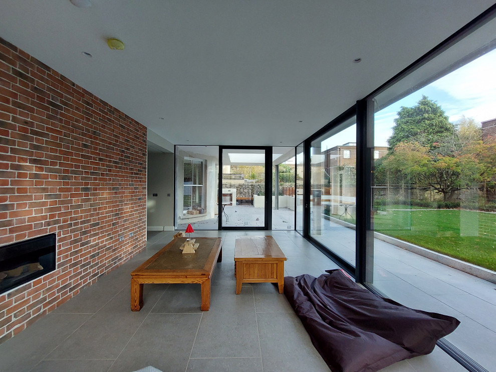 Contemporary glazed extension connects historic house to garden