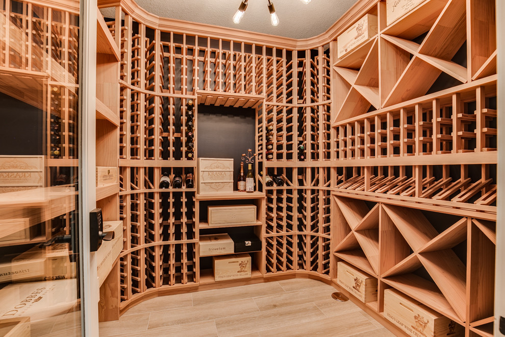 Inspiration for a beach style wine cellar in Minneapolis with light hardwood floors, diamond bins and beige floor.