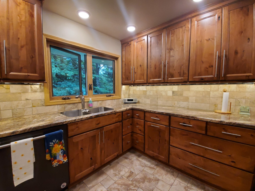 Inspiration for a small transitional porcelain tile and beige floor kitchen remodel with an undermount sink, recessed-panel cabinets, brown cabinets, laminate countertops, beige backsplash, porcelain backsplash, stainless steel appliances, no island and brown countertops