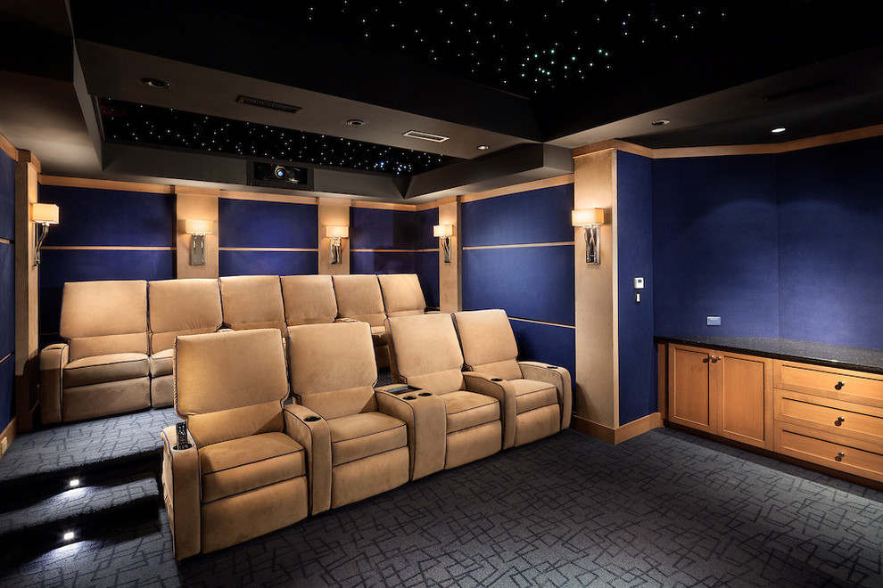 Design ideas for a large contemporary enclosed home theatre in New York with blue walls, carpet and beige floor.