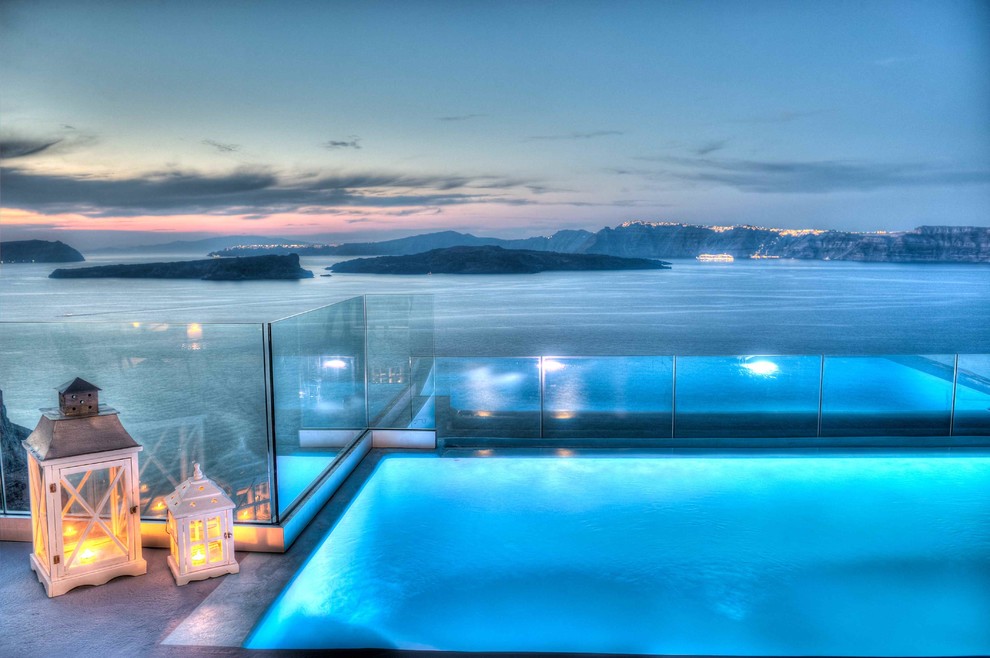 This is an example of a large mediterranean backyard infinity pool in Other.