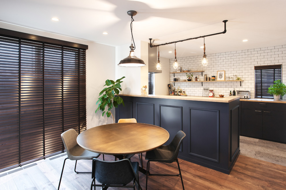 Inspiration for a large midcentury open plan dining in Other with white walls, dark hardwood floors and brown floor.