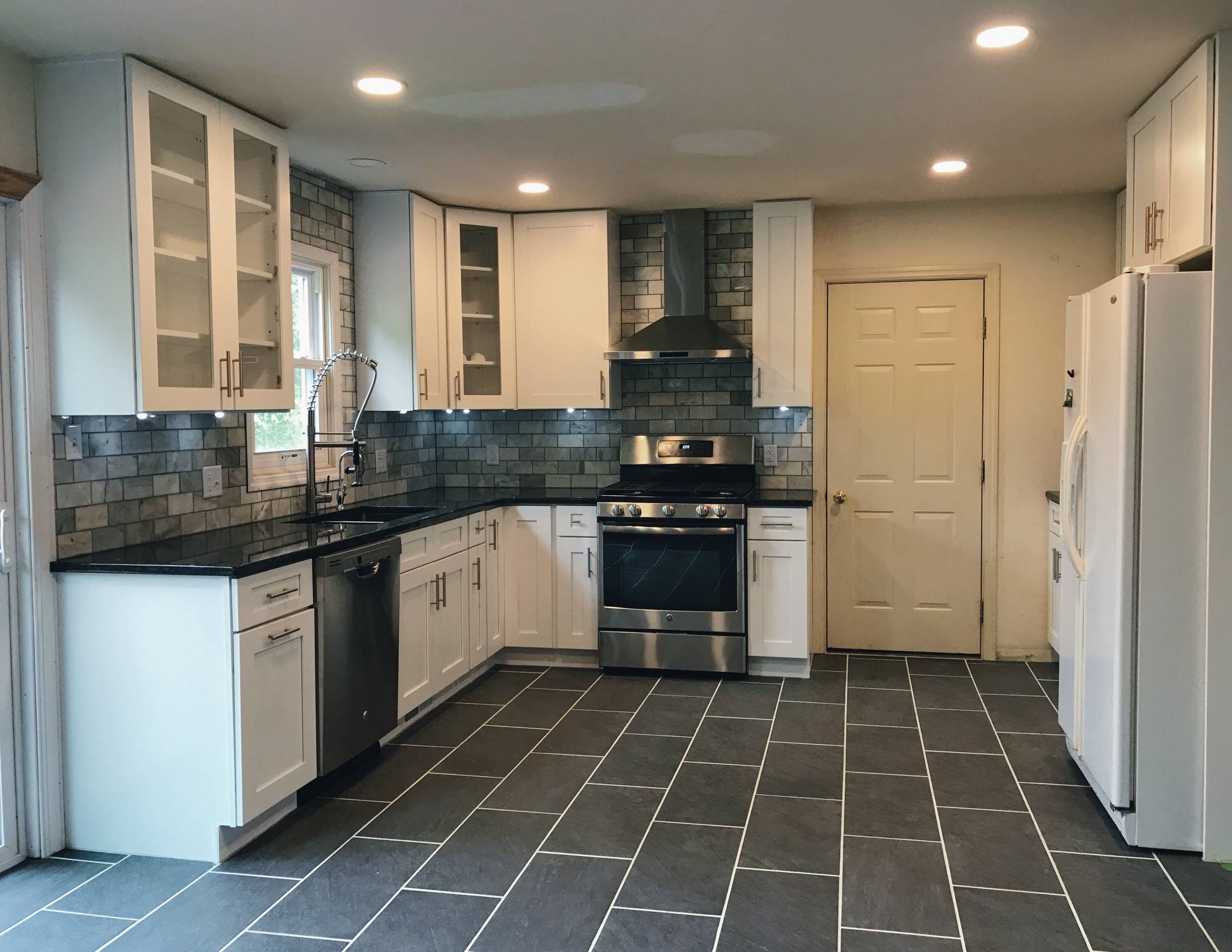 Kitchen Renovation with Polished Stone Backsplash