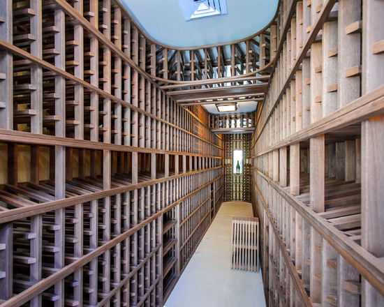 Large traditional wine cellar in San Francisco with laminate floors and storage racks.