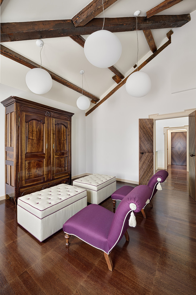 Contemporary enclosed family room in Venice with white walls and dark hardwood floors.