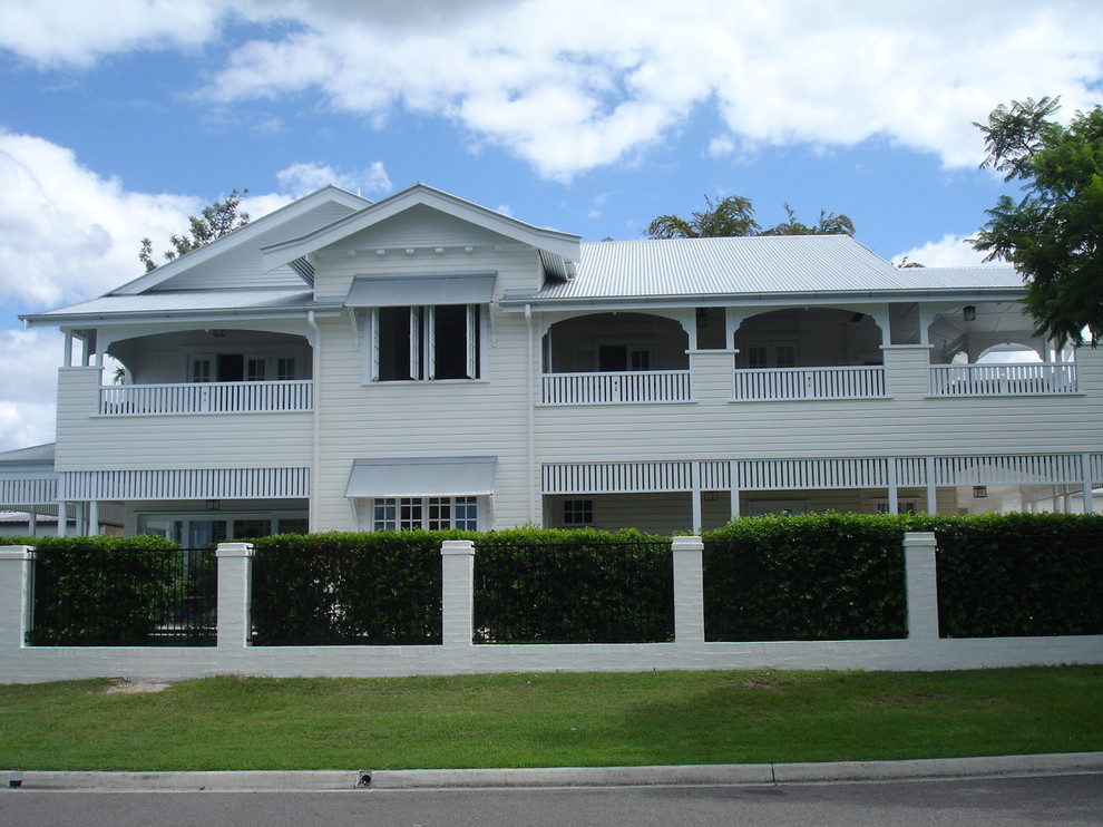 Design ideas for a traditional two-storey exterior in Brisbane with wood siding.