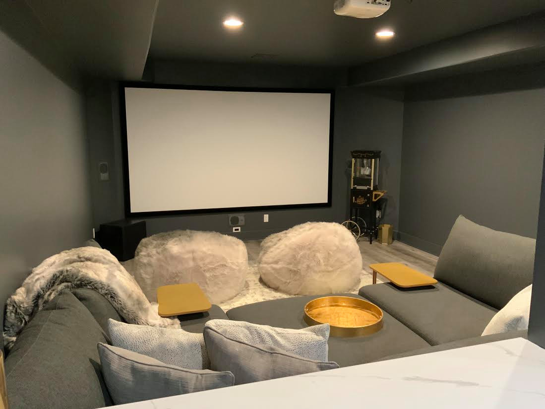 A Transitional Fun Family Basement with Bathroom, Gym, Movie Room and Gaming Ar