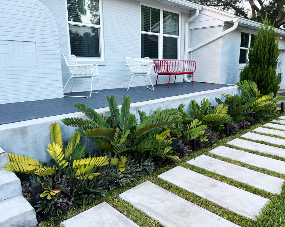 Mid-sized midcentury front yard full sun garden in Jacksonville with with path.