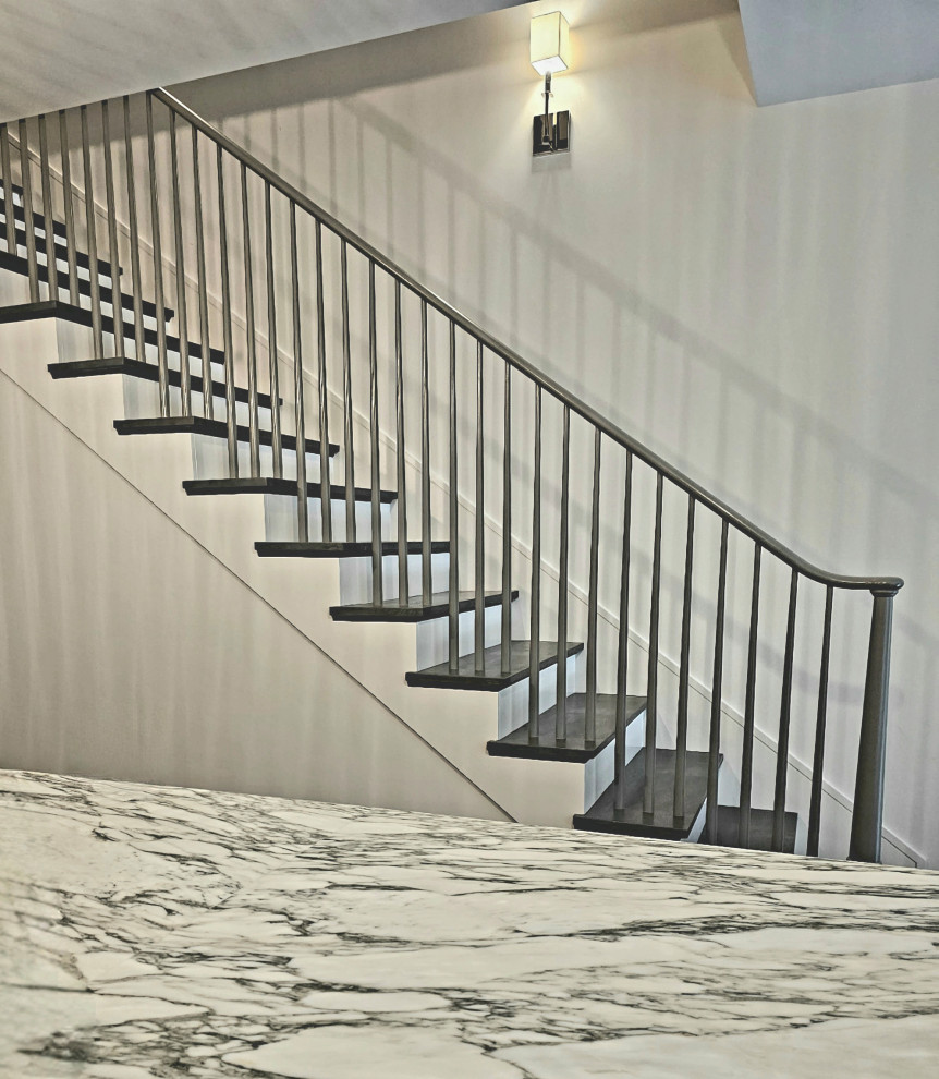 Staircase - huge transitional wooden straight wood railing staircase idea in DC Metro with painted risers