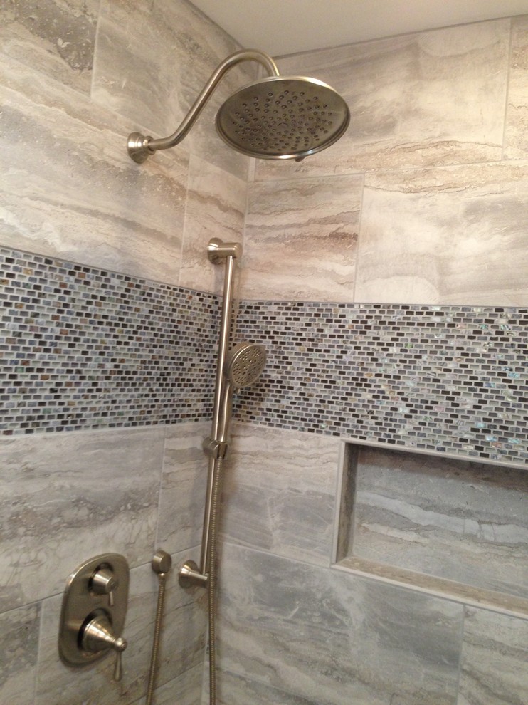 Example of a small transitional 3/4 gray tile, white tile and porcelain tile porcelain tile doorless shower design in Baltimore with raised-panel cabinets, dark wood cabinets, a two-piece toilet, white walls, a vessel sink and quartzite countertops