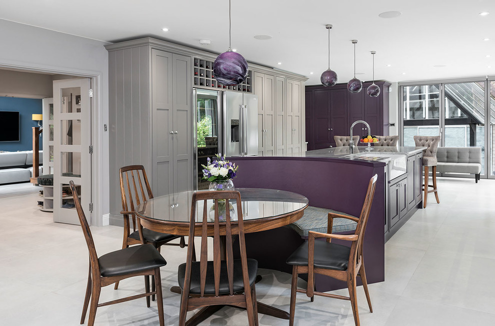 Photo of an expansive transitional u-shaped eat-in kitchen in Surrey with a farmhouse sink, shaker cabinets, purple cabinets, granite benchtops, stainless steel appliances, ceramic floors, with island, grey floor and grey benchtop.