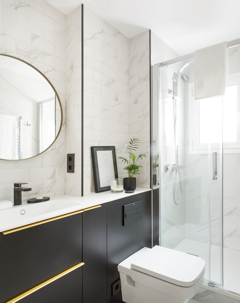 This is an example of a contemporary shower room bathroom in Barcelona with a one-piece toilet, white worktops, a single sink and a built in vanity unit.