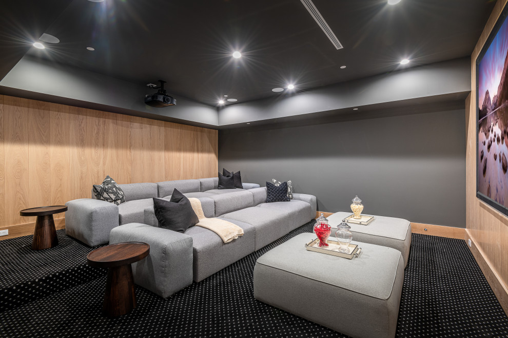 This is an example of a contemporary home cinema in Los Angeles with a feature wall.