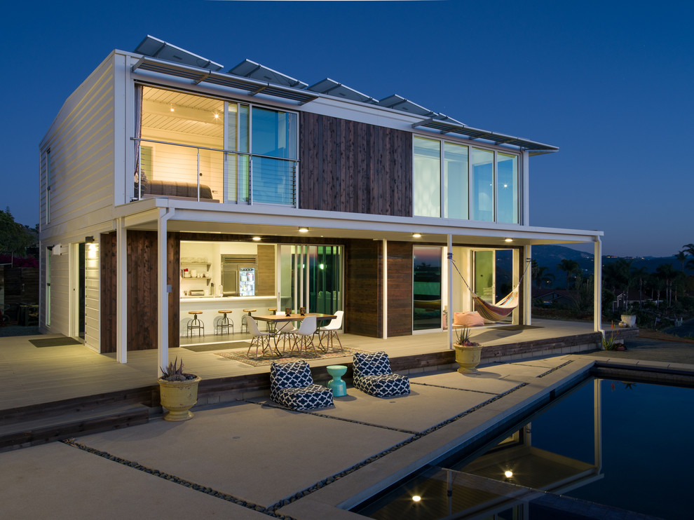 Large contemporary two-storey white exterior in San Diego with wood siding and a flat roof.