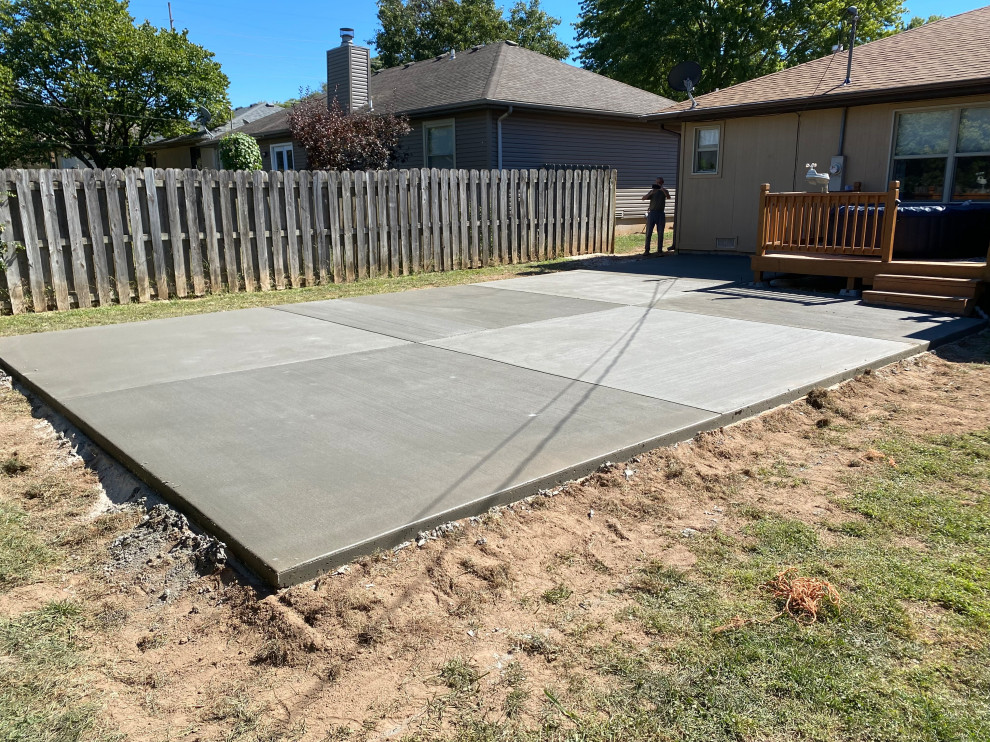 Patio - mid-sized backyard concrete patio idea