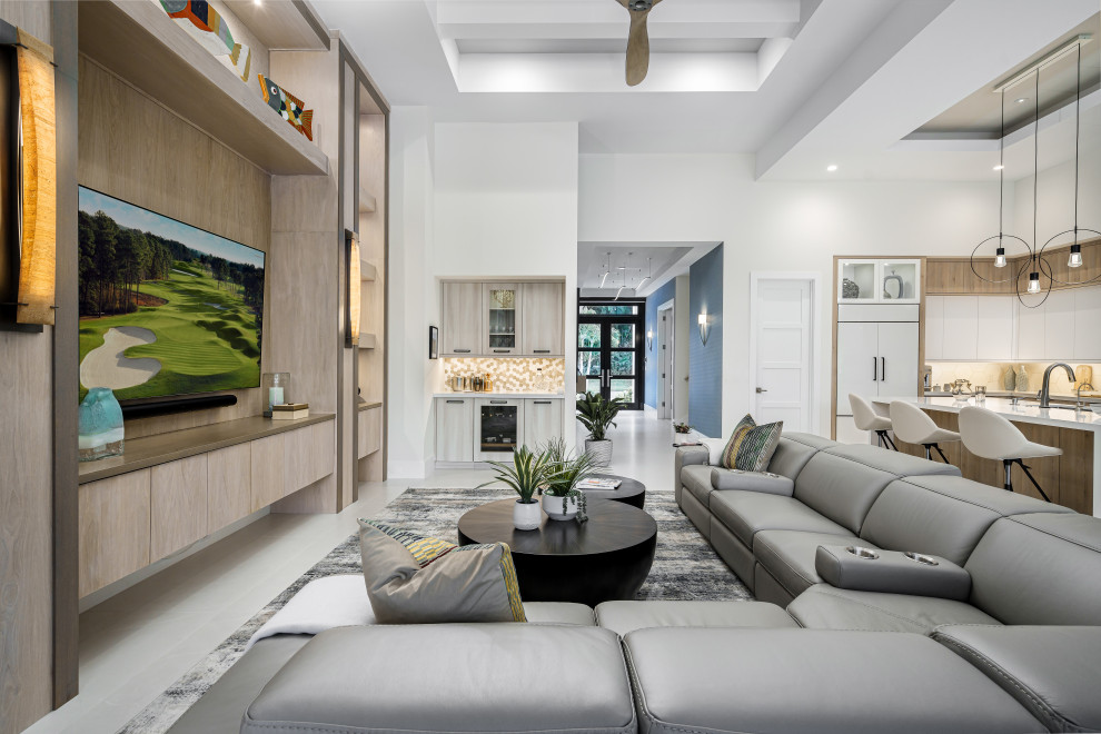 Contemporary living room in Miami with white walls, grey floors and a drop ceiling.