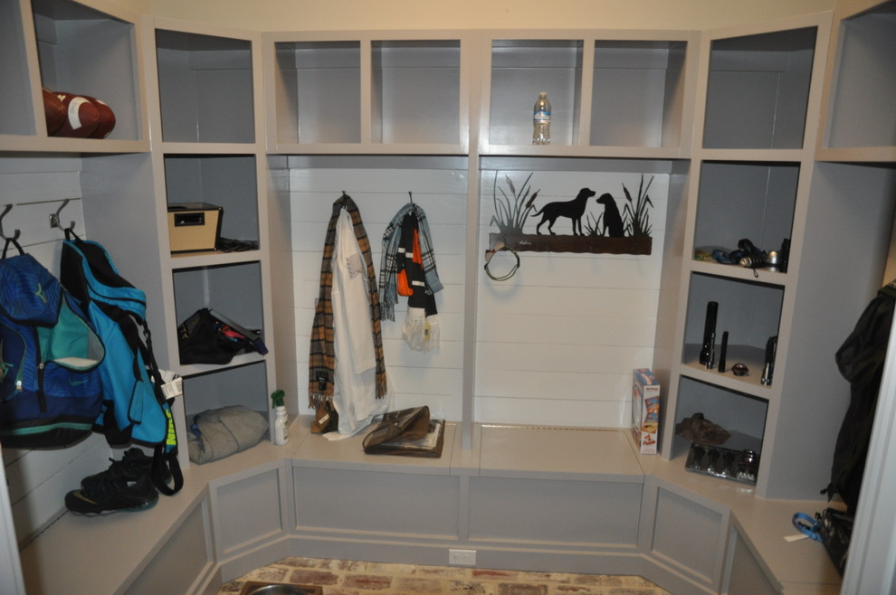 Mid-sized transitional brick floor and multicolored floor mudroom photo with white walls
