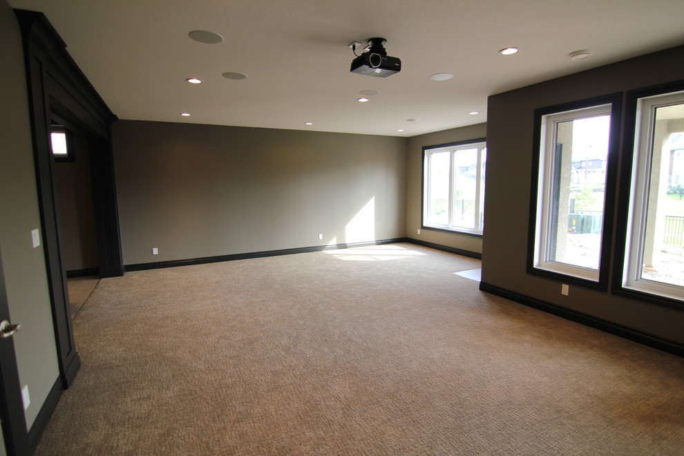 Inspiration for a small transitional open concept home theatre in Other with beige walls and carpet.