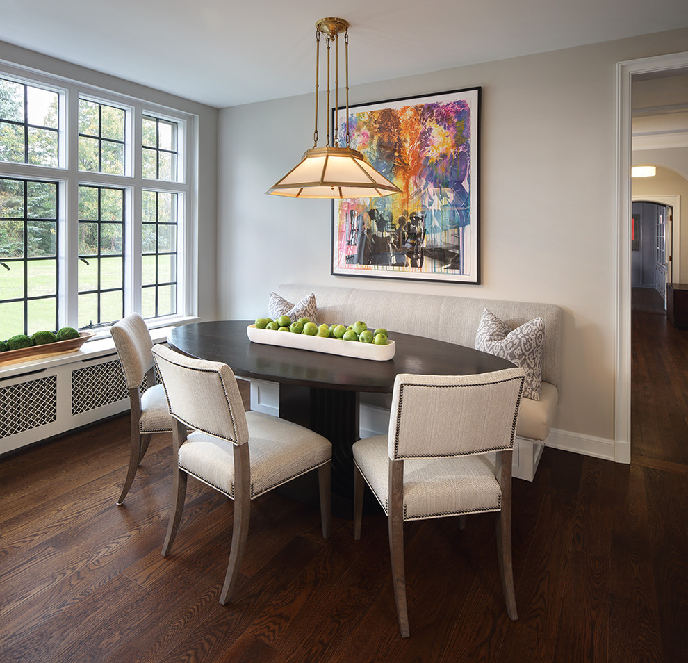 This is an example of a transitional dining room in Cleveland.