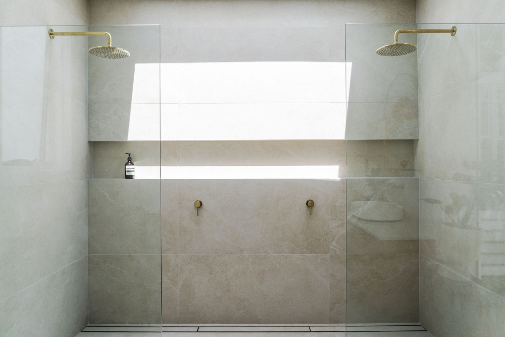 Large mediterranean master bathroom in Perth with medium wood cabinets, a double shower, a one-piece toilet, beige tile, ceramic tile, white walls, ceramic floors, engineered quartz benchtops, an open shower, white benchtops, a niche, a single vanity and a floating vanity.