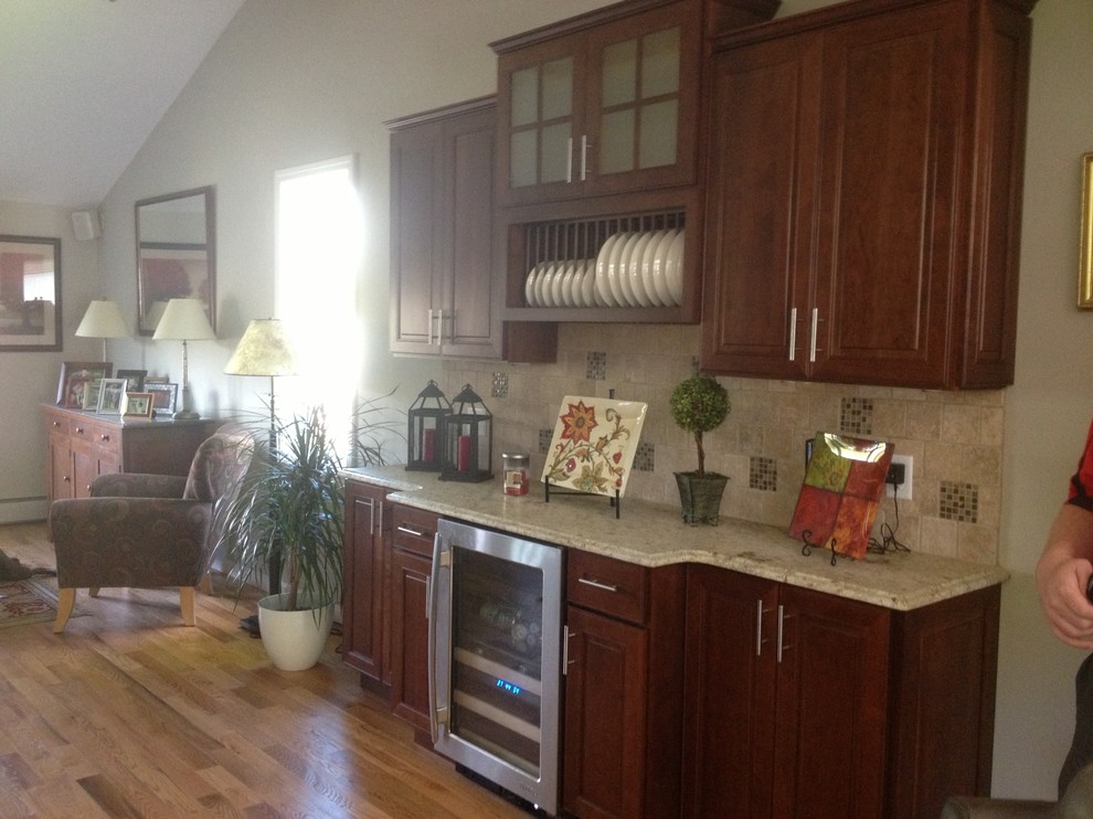 Mid-sized eclectic l-shaped medium tone wood floor eat-in kitchen photo in Bridgeport with an undermount sink, shaker cabinets, dark wood cabinets, granite countertops, beige backsplash, ceramic backsplash, stainless steel appliances and an island