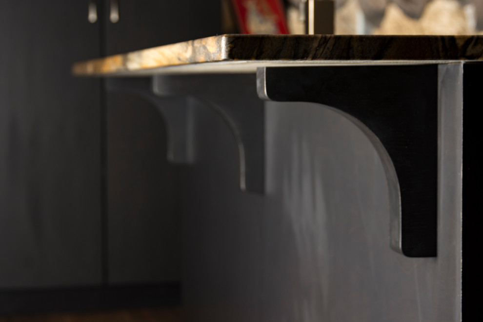 Mid-sized trendy l-shaped porcelain tile open concept kitchen photo in Cincinnati with a double-bowl sink, flat-panel cabinets, black cabinets, granite countertops, metallic backsplash, porcelain backsplash, stainless steel appliances and an island