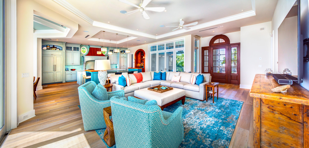 Mid-sized beach style living room in Tampa with light hardwood floors and brown floor.