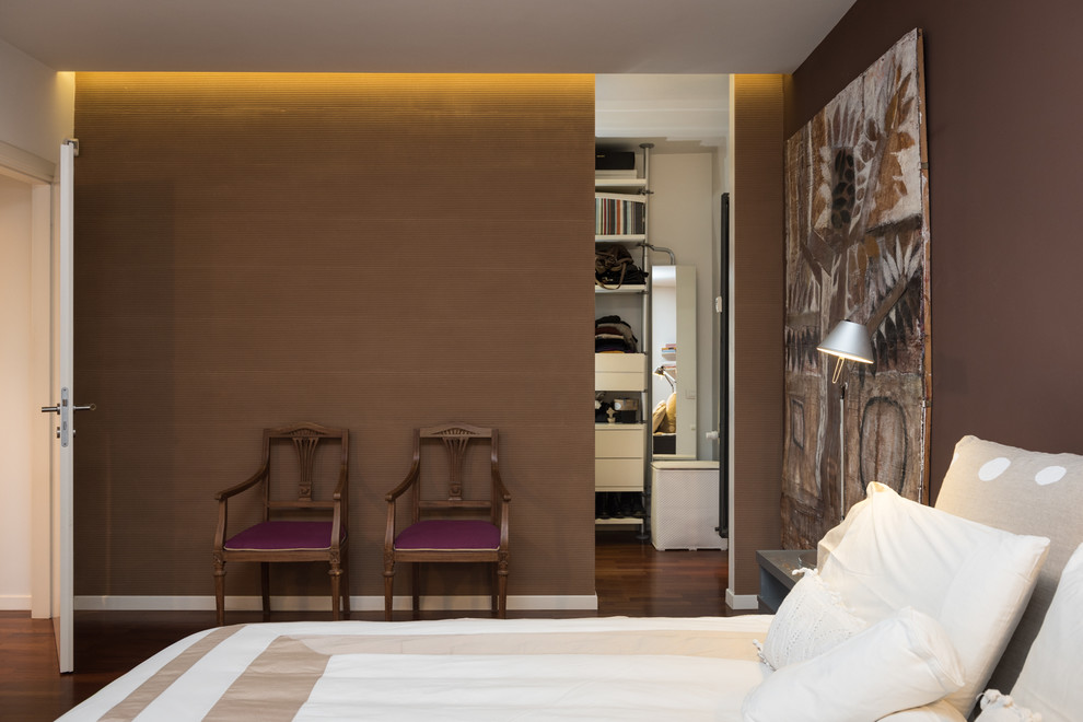 Contemporary master bedroom in Rome with brown walls, dark hardwood floors and no fireplace.