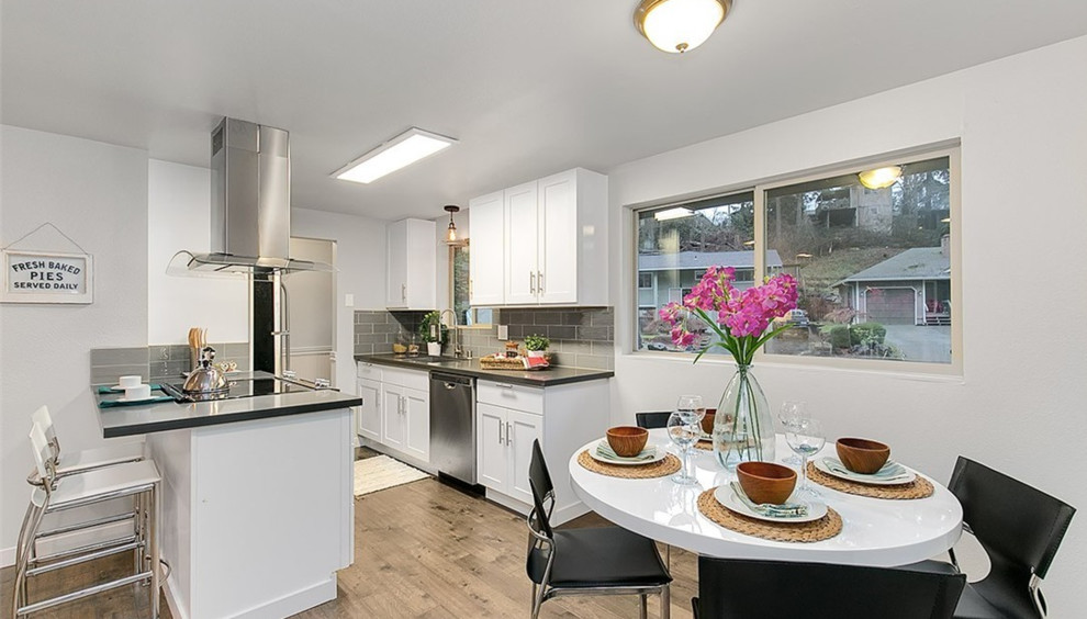 Small transitional dark wood floor kitchen/dining room combo photo in Seattle with gray walls and no fireplace