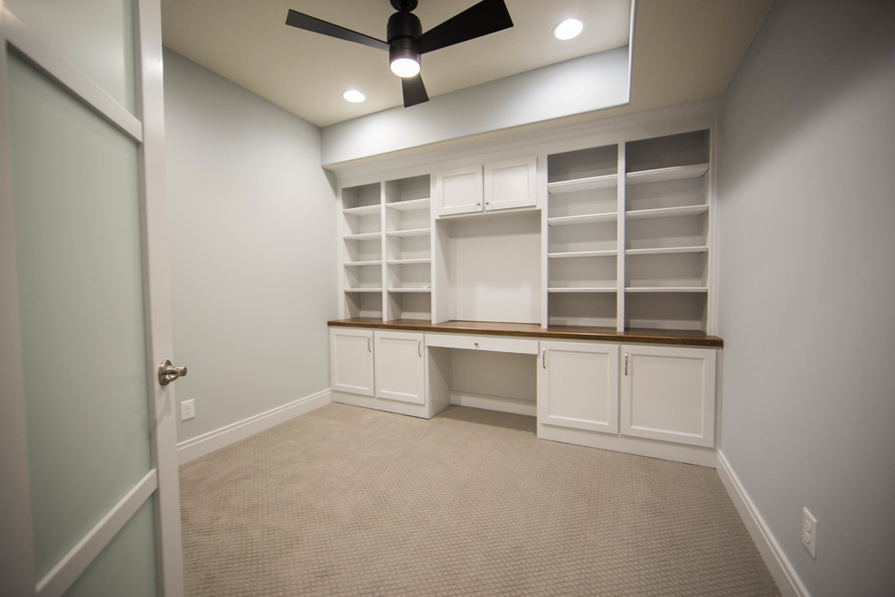 Inspiration for a mid-sized arts and crafts study room in Indianapolis with a built-in desk.