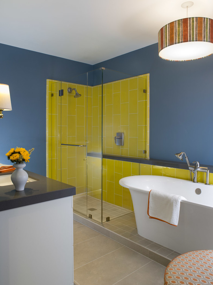 Inspiration for a mid-sized contemporary master bathroom in San Francisco with white cabinets, engineered quartz benchtops, a freestanding tub, yellow tile, glass tile, blue walls and porcelain floors.