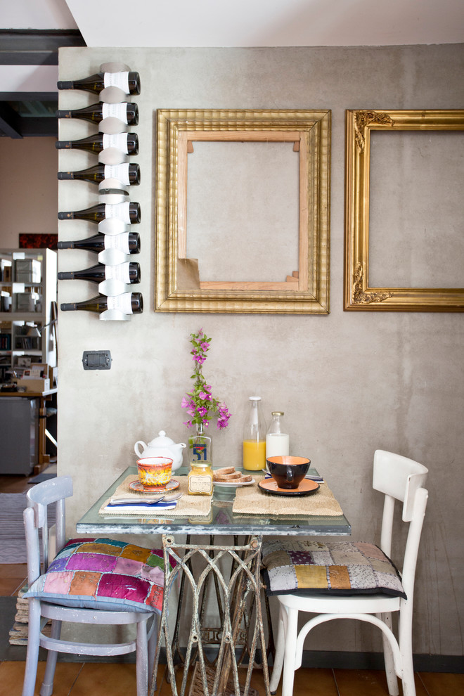 This is an example of an eclectic dining room in Naples.