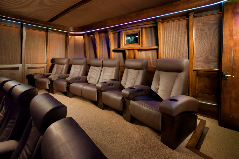 Design ideas for a large modern enclosed home theatre in Phoenix with brown walls, carpet and a projector screen.