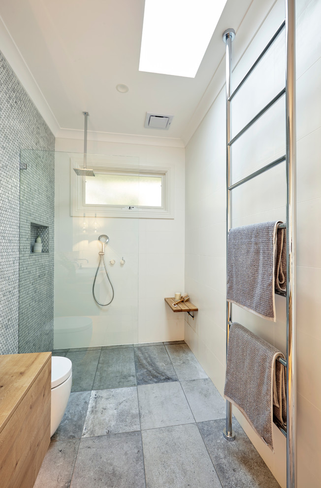 Inspiration for a mid-sized contemporary master bathroom in Sydney with medium wood cabinets, a one-piece toilet, gray tile, mosaic tile, white walls, ceramic floors, a vessel sink, wood benchtops, flat-panel cabinets, an alcove shower and an open shower.