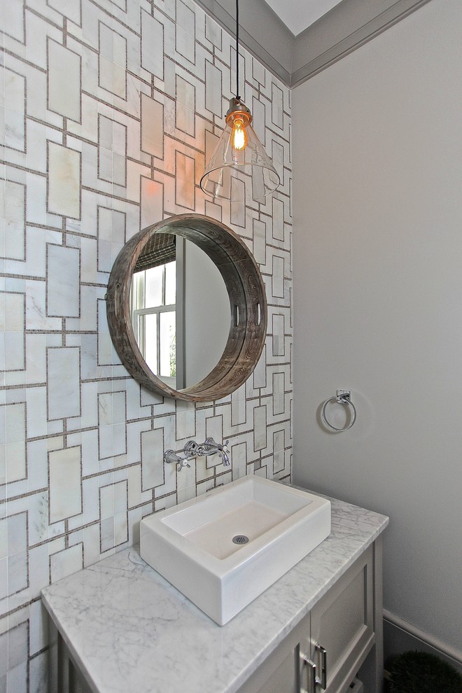 Inspiration for a beach style bathroom in Charleston with a vessel sink, grey cabinets, white tile and shaker cabinets.